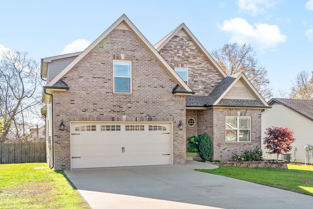 craftsman-style home with a garage and a front yard