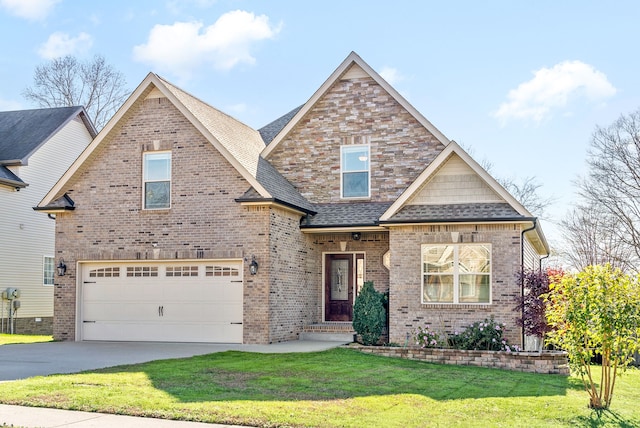 craftsman house featuring a front yard and a garage