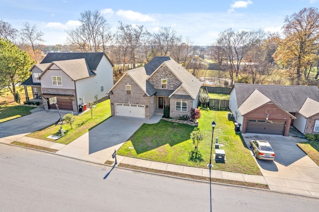 view of front of home featuring a front yard and a garage