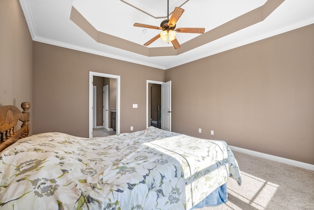 bedroom with a raised ceiling, ceiling fan, crown molding, and carpet floors