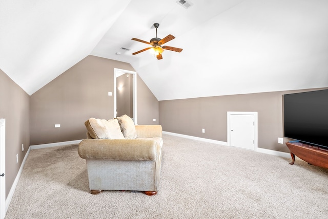 living area with ceiling fan, light colored carpet, and vaulted ceiling