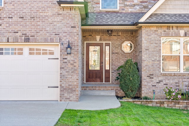 view of exterior entry with a garage