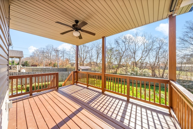 wooden deck featuring ceiling fan