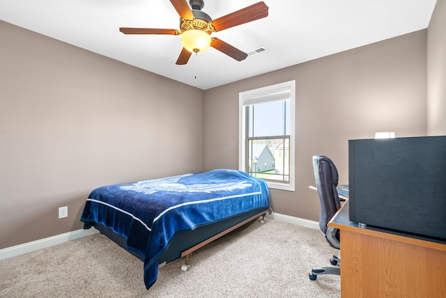 bedroom with light colored carpet and ceiling fan