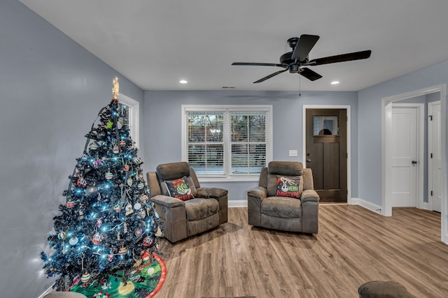 sitting room featuring ceiling fan and light hardwood / wood-style flooring