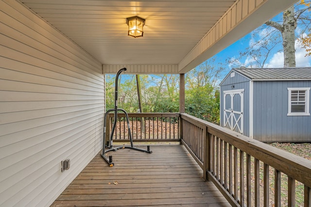 wooden deck featuring a storage unit