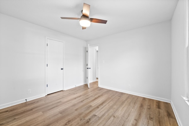 unfurnished bedroom with ceiling fan and light hardwood / wood-style flooring