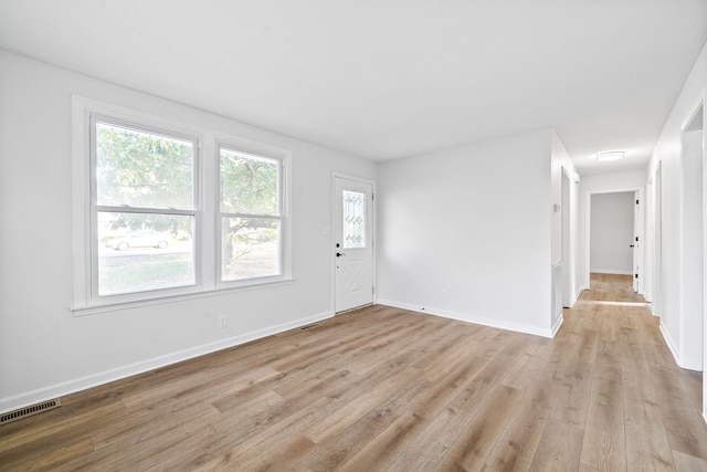 unfurnished room featuring light wood-type flooring