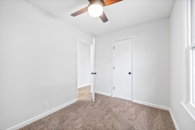 unfurnished bedroom featuring carpet flooring and ceiling fan