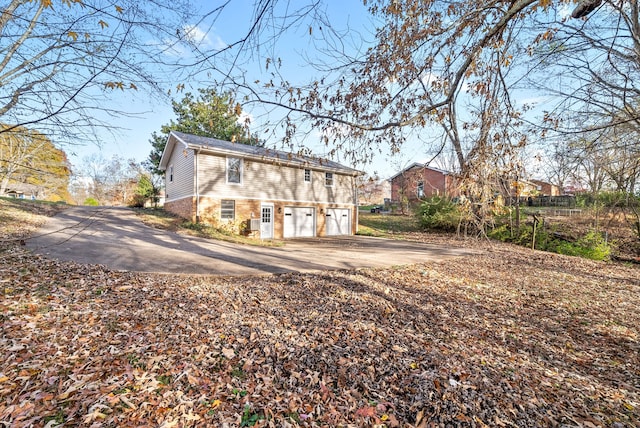 back of property with a garage