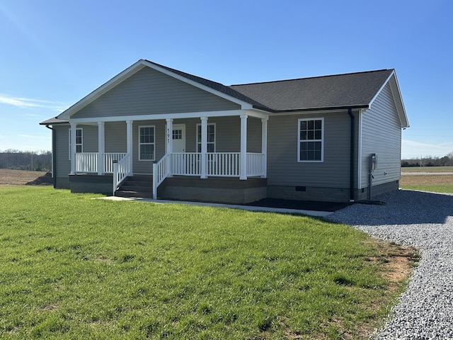 view of front of property featuring covered porch and a front yard