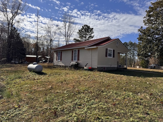 view of property exterior with a yard