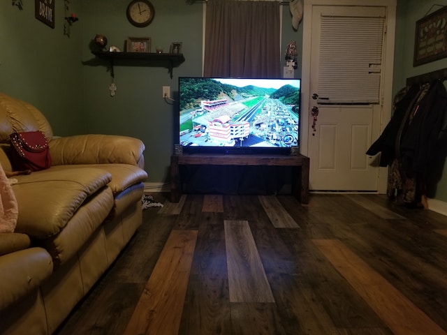 living room with dark hardwood / wood-style flooring