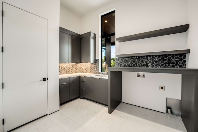 laundry area featuring sink, hookup for a washing machine, cabinets, and hookup for an electric dryer