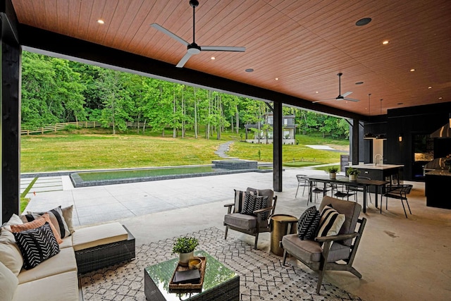 view of patio / terrace with an outdoor hangout area and ceiling fan