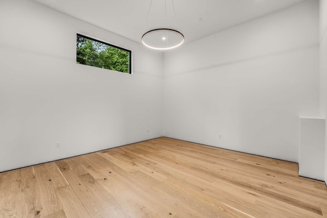 unfurnished room featuring light hardwood / wood-style flooring