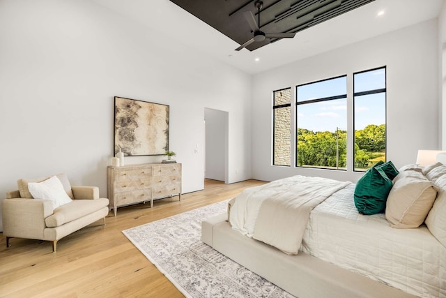 bedroom featuring hardwood / wood-style flooring and ceiling fan