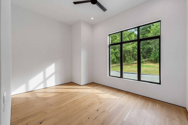 unfurnished room featuring ceiling fan and light hardwood / wood-style flooring