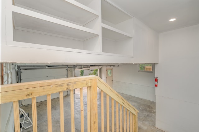 staircase with concrete flooring