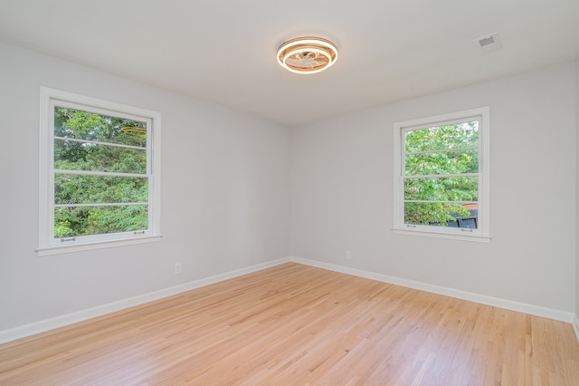 spare room featuring light hardwood / wood-style floors