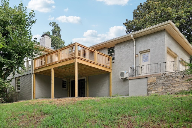 rear view of property featuring a deck