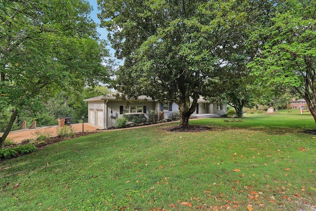 view of yard with a garage