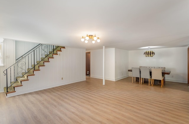 interior space with a chandelier and light hardwood / wood-style flooring