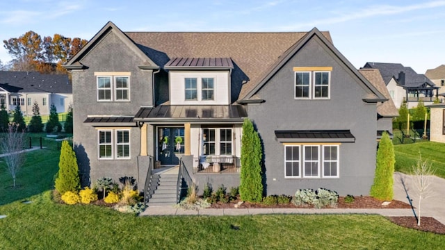 view of front of property featuring a porch and a front yard