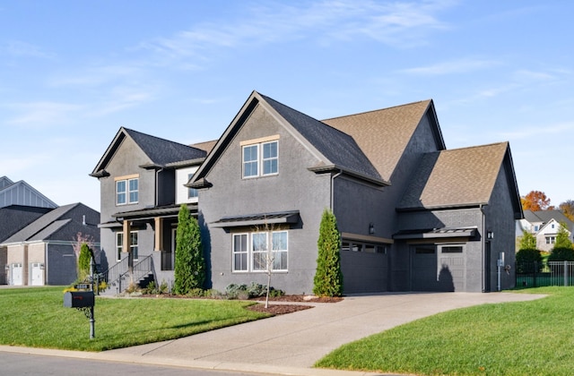 view of front of home featuring a front lawn, a porch, and a garage