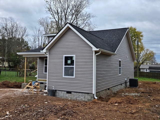 view of side of property with cooling unit