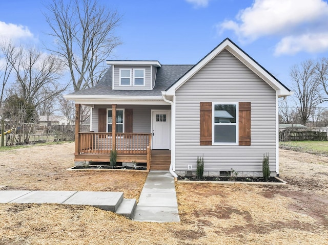 bungalow-style home with a porch and a shingled roof