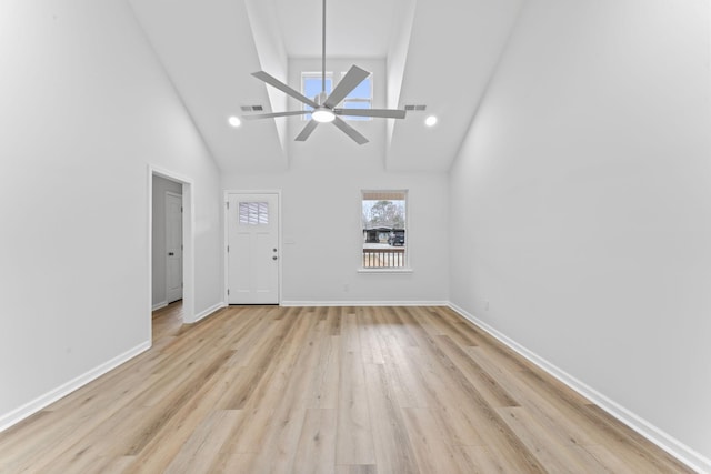 unfurnished living room with light wood-type flooring, visible vents, and baseboards