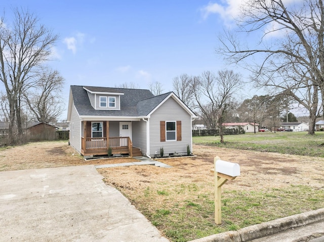 bungalow featuring a porch and a shingled roof