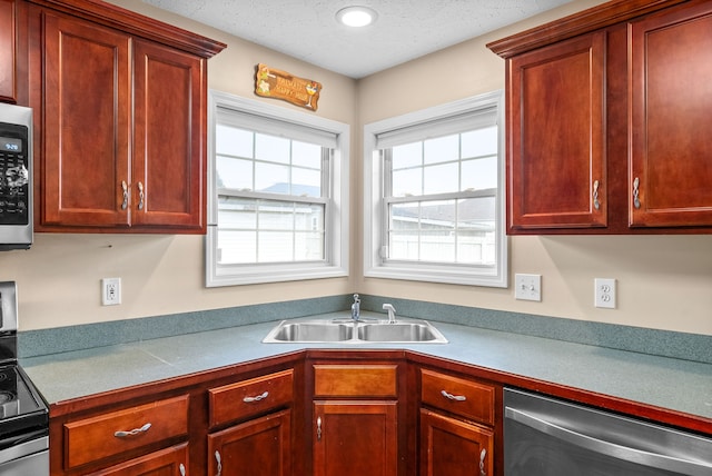 kitchen with sink and appliances with stainless steel finishes