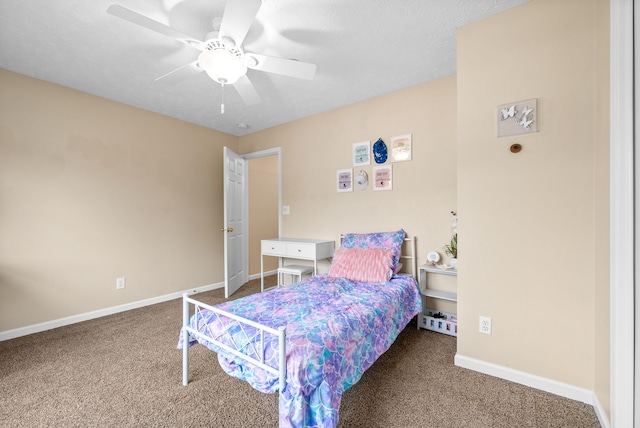 bedroom with carpet, a textured ceiling, and ceiling fan