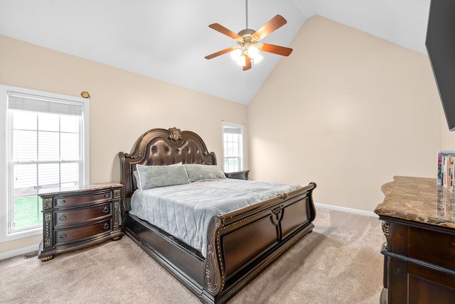 carpeted bedroom featuring high vaulted ceiling, multiple windows, and ceiling fan