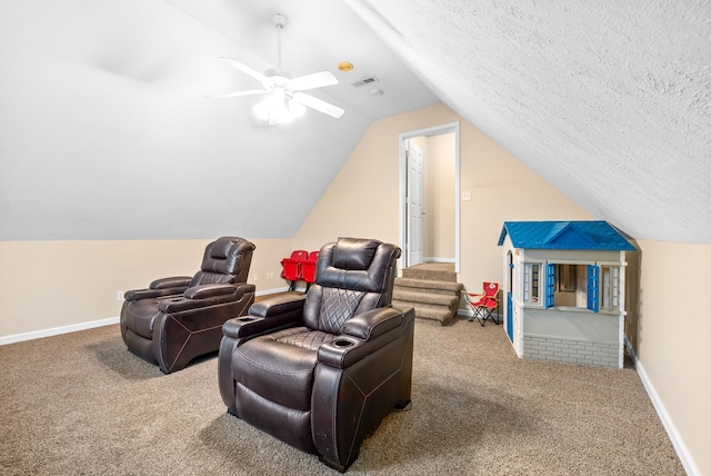 cinema featuring carpet flooring, ceiling fan, a textured ceiling, and vaulted ceiling