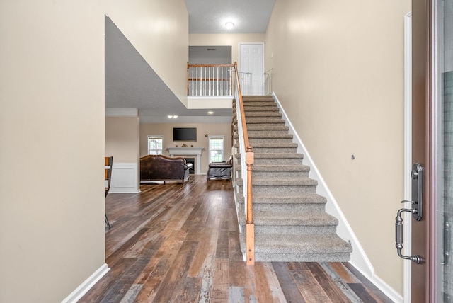 entrance foyer featuring dark hardwood / wood-style floors and ornamental molding