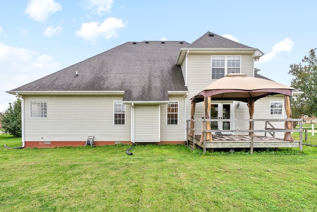 back of house featuring a gazebo, a lawn, and a wooden deck