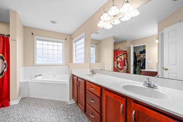 bathroom featuring tile patterned flooring, vanity, shower with separate bathtub, and a chandelier