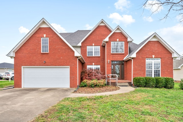 front of property featuring a garage and a front lawn