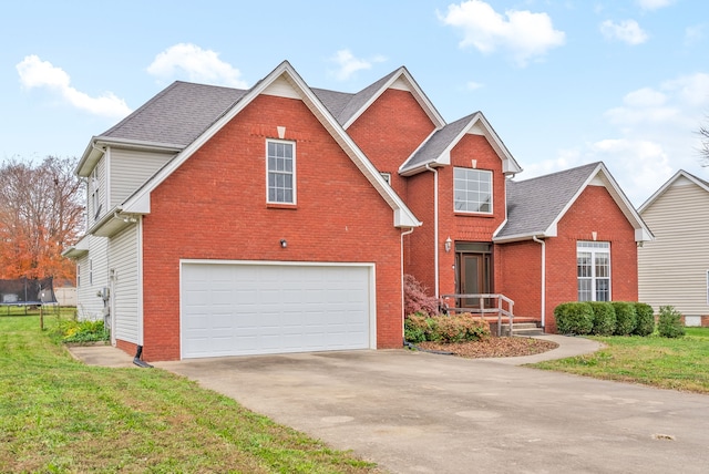 front facade featuring a garage and a front yard