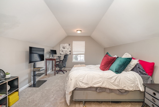 bedroom with light carpet and lofted ceiling