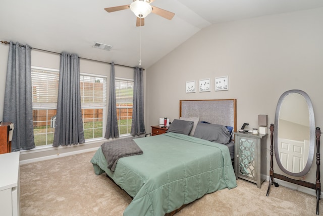 carpeted bedroom featuring ceiling fan and lofted ceiling