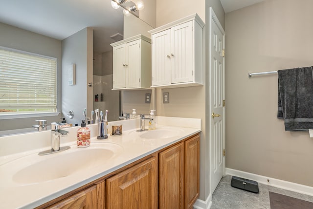 bathroom featuring tile patterned flooring and vanity