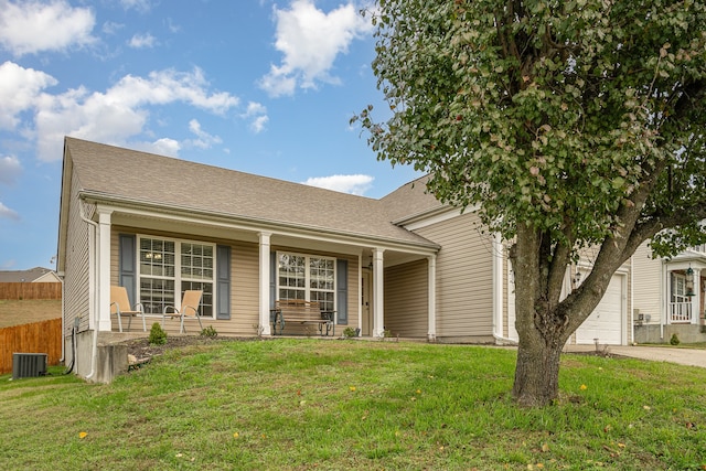 view of front of home with central air condition unit, a front lawn, and a porch