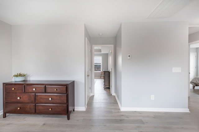 corridor featuring light hardwood / wood-style floors