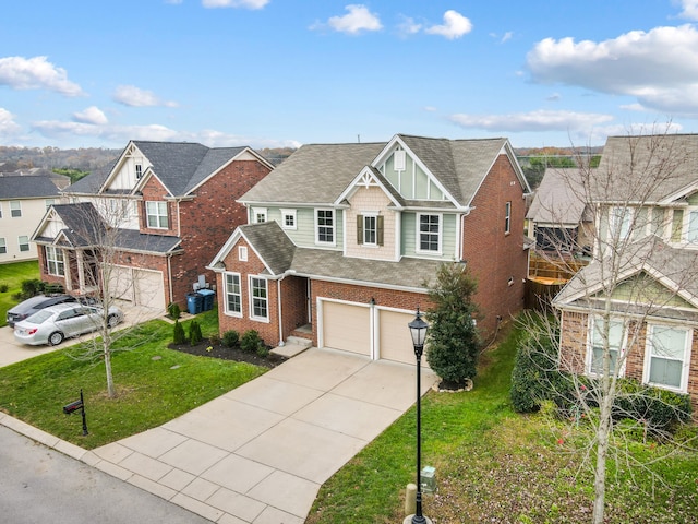 view of front of house with a front yard and a garage