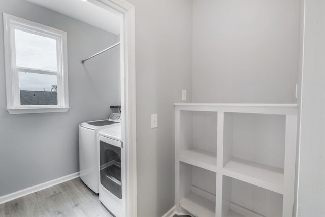 laundry area featuring hardwood / wood-style floors and independent washer and dryer