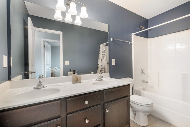 full bathroom featuring tile patterned floors, vanity, shower / bath combination with curtain, and toilet